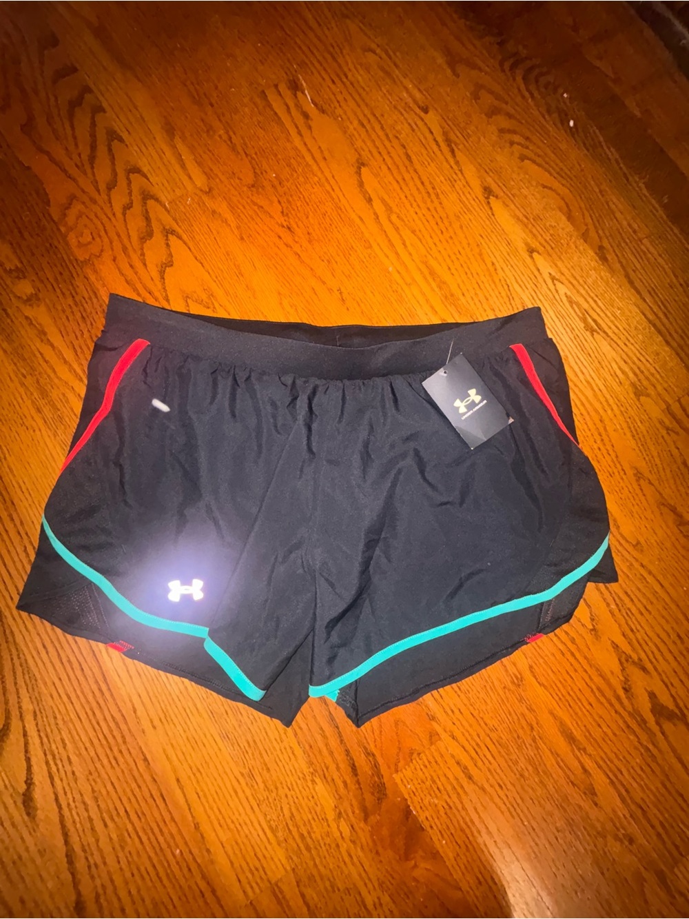 Under Armour Black Athletic Shorts with Teal Piping and Red Accents